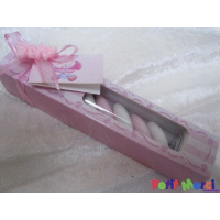 Glazen buisje in roze of blauw doosje met dragees