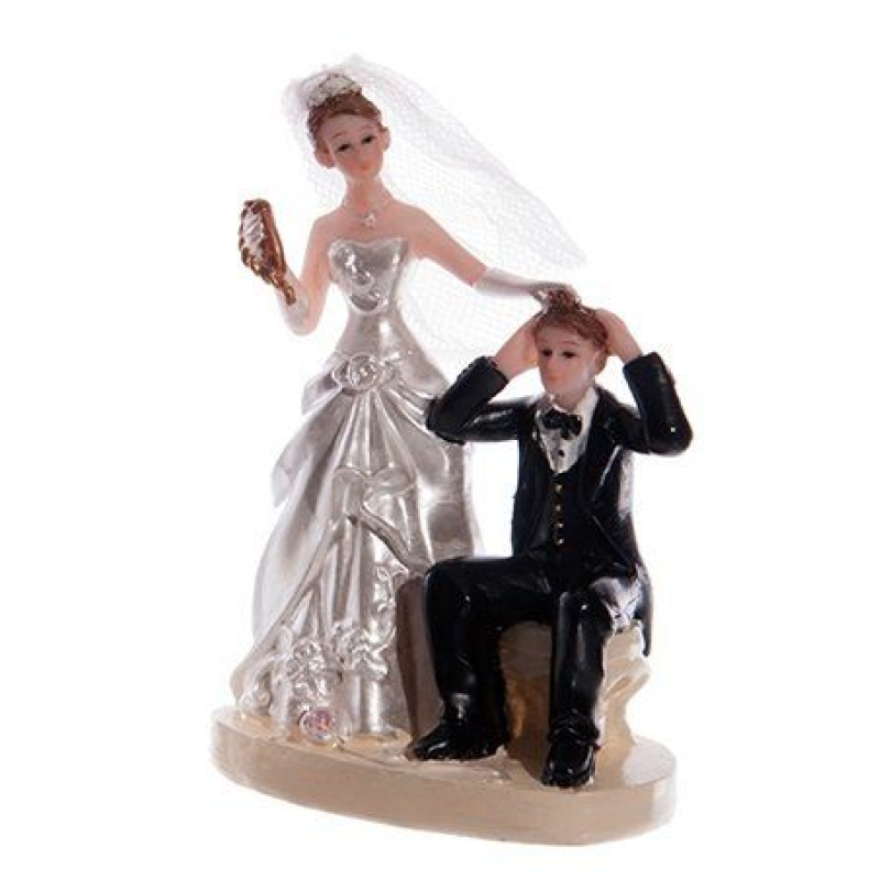 taarttopping bruidspaar bruid pakt man bij haren